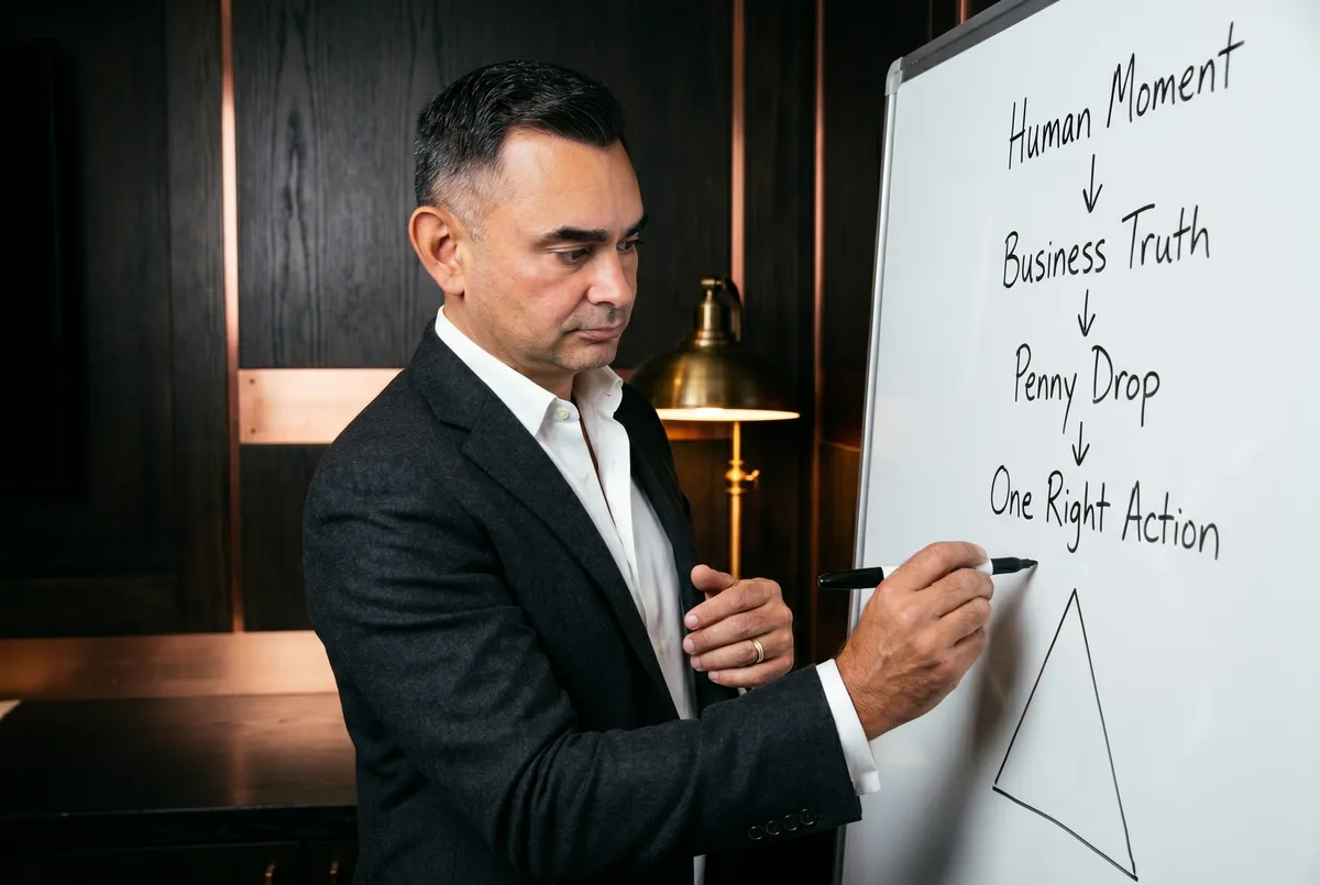 Will Turner at a whiteboard mapping the Simplexity framework
